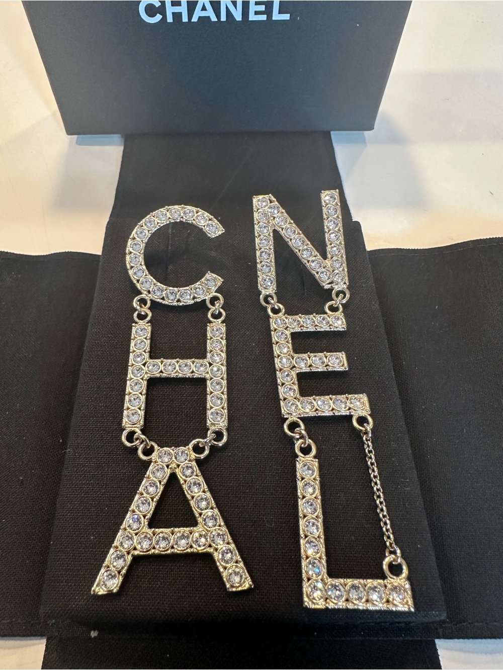 CHANEL Silver Crystal Logo Drop Earrings